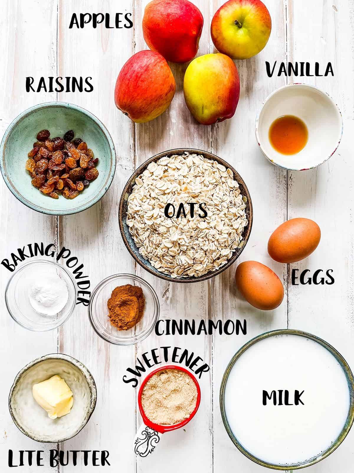 Dishes of the ingredients to make low calorie baked oatmeal set out on a table.