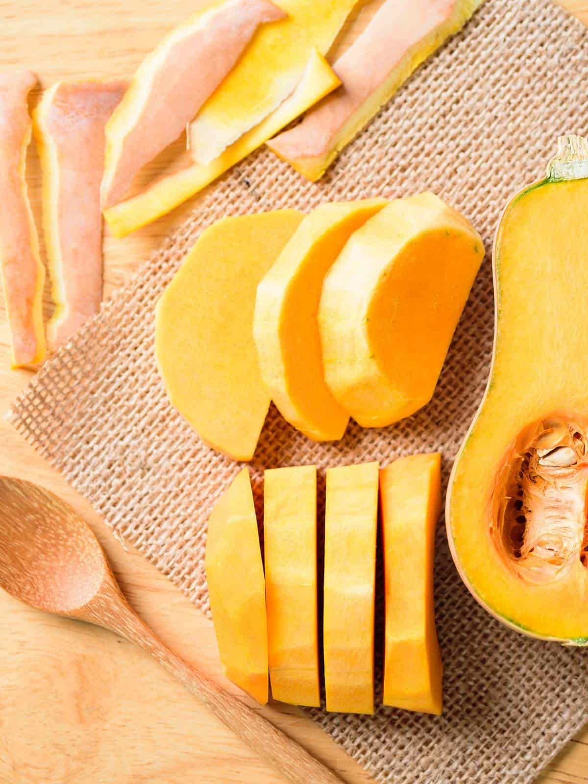 Sliced butternut squash on a mat.