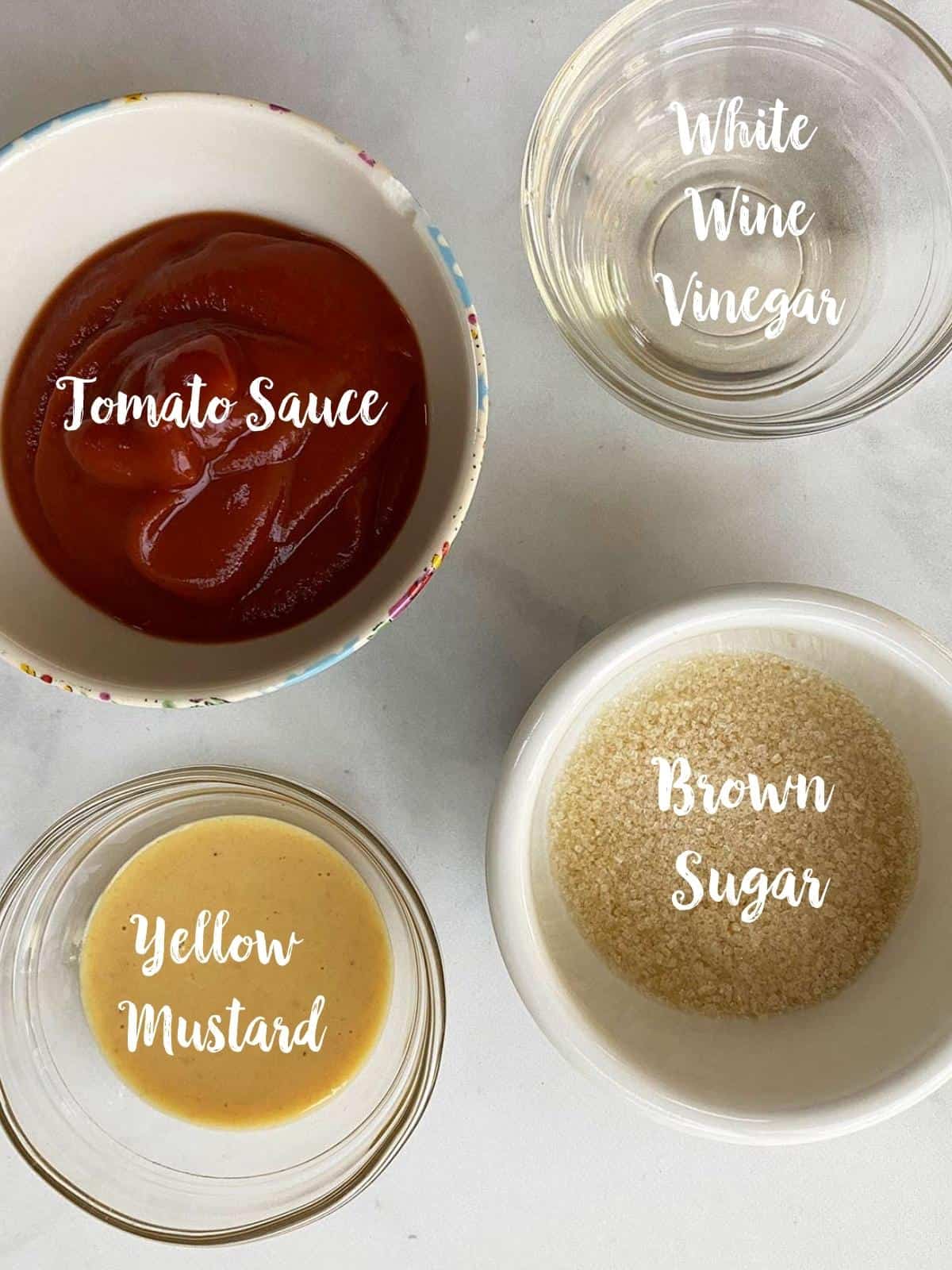 Ingredients to make topping for low calorie meatloaf in bowls on a white table.