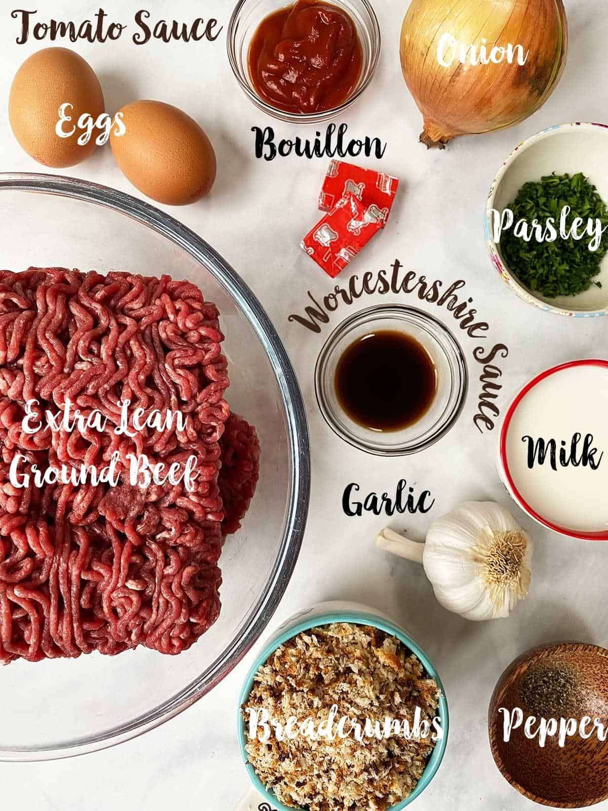 Ingredients to make low calorie meatloaf labelled on a table.