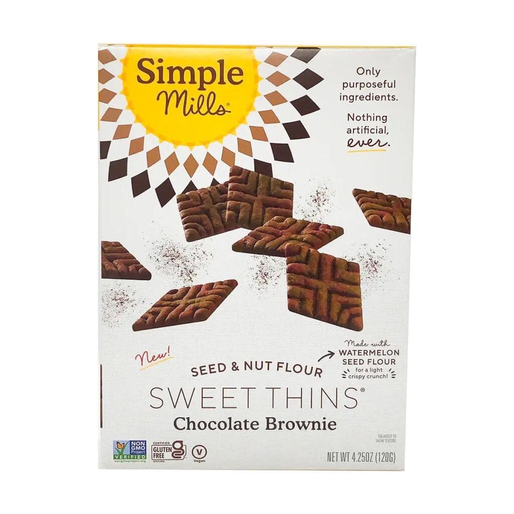 A box of Simple Mills Sweet Thins Chocolate Brownie flavor on a white background.